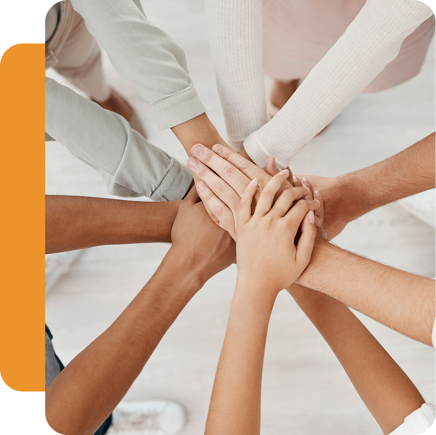Hands joined together in teamwork gesture.